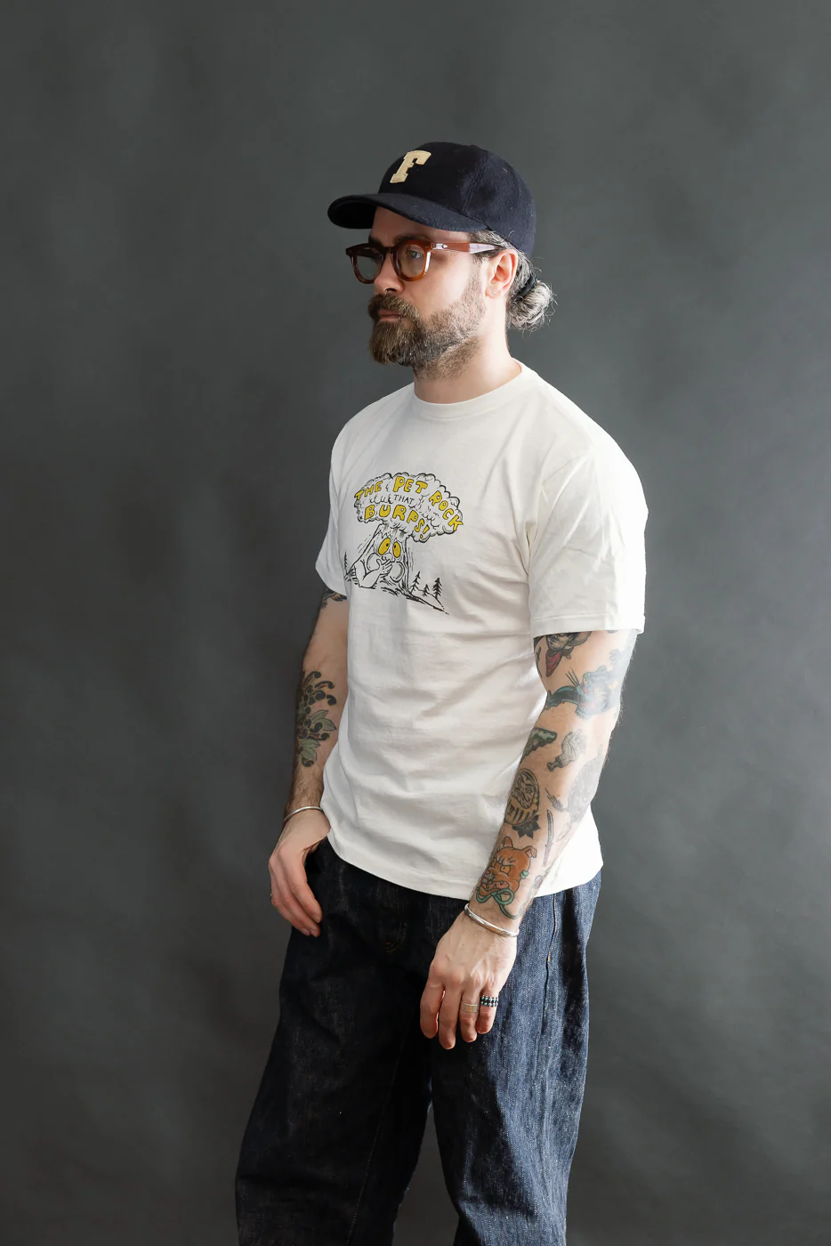 5.4oz - Raffy Tenjiku Printed T-Shirt "The Pet Rock" - Off White - Image 9